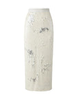 The Le Superbe Malibu Sand Liza Skirt is a high-waisted pull-on pencil skirt adorned with shiny silver sequins, shown against a plain white background.