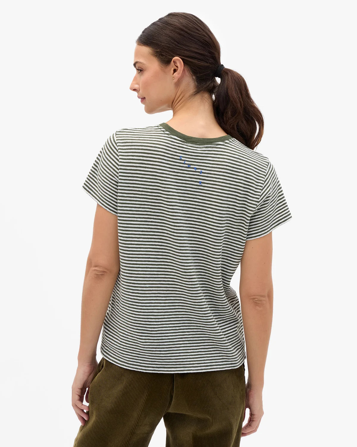 Clare Vivier Classic Tee with OUI graphic in white, styled with brown pants, shown from the back.
