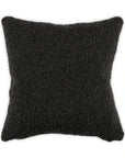 Black Moss Studio Curl Up Pillow in textured boucle fabric with knife edge, shown against a white background.