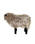 The Faire Tibetan Lamb Sheep is a high-quality, life-sized sculpture with curly beige wool, black legs on a white background, and a partially obscured face by its fluffy coat, making it an enchanting nursery accessory.