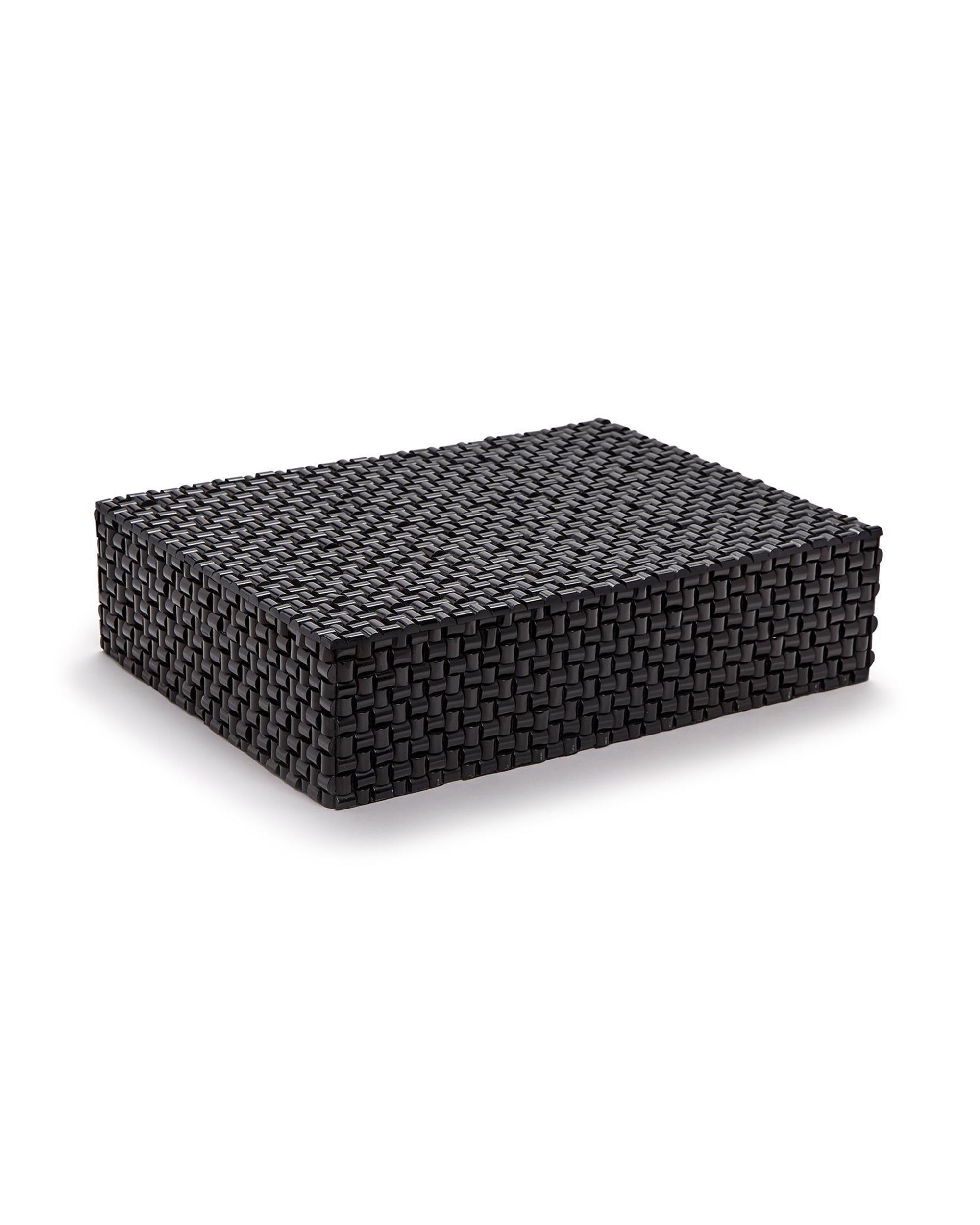 The DGJ144 Nomad BOX by Two's Company is a rectangular, black handmade storage box with a flat lid, displayed against a white background. Its interlaced texture lends this sturdy box a modern, elegant look.