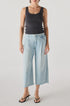 A person wearing the AMO Denim Donna Trouser stands against a plain white background.