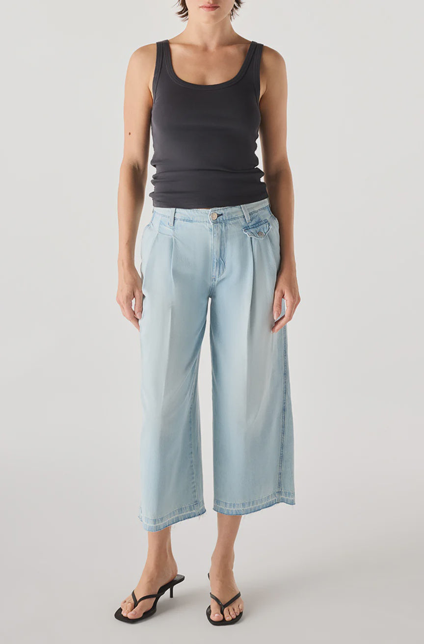 A person wearing the AMO Denim Donna Trouser stands against a plain white background.