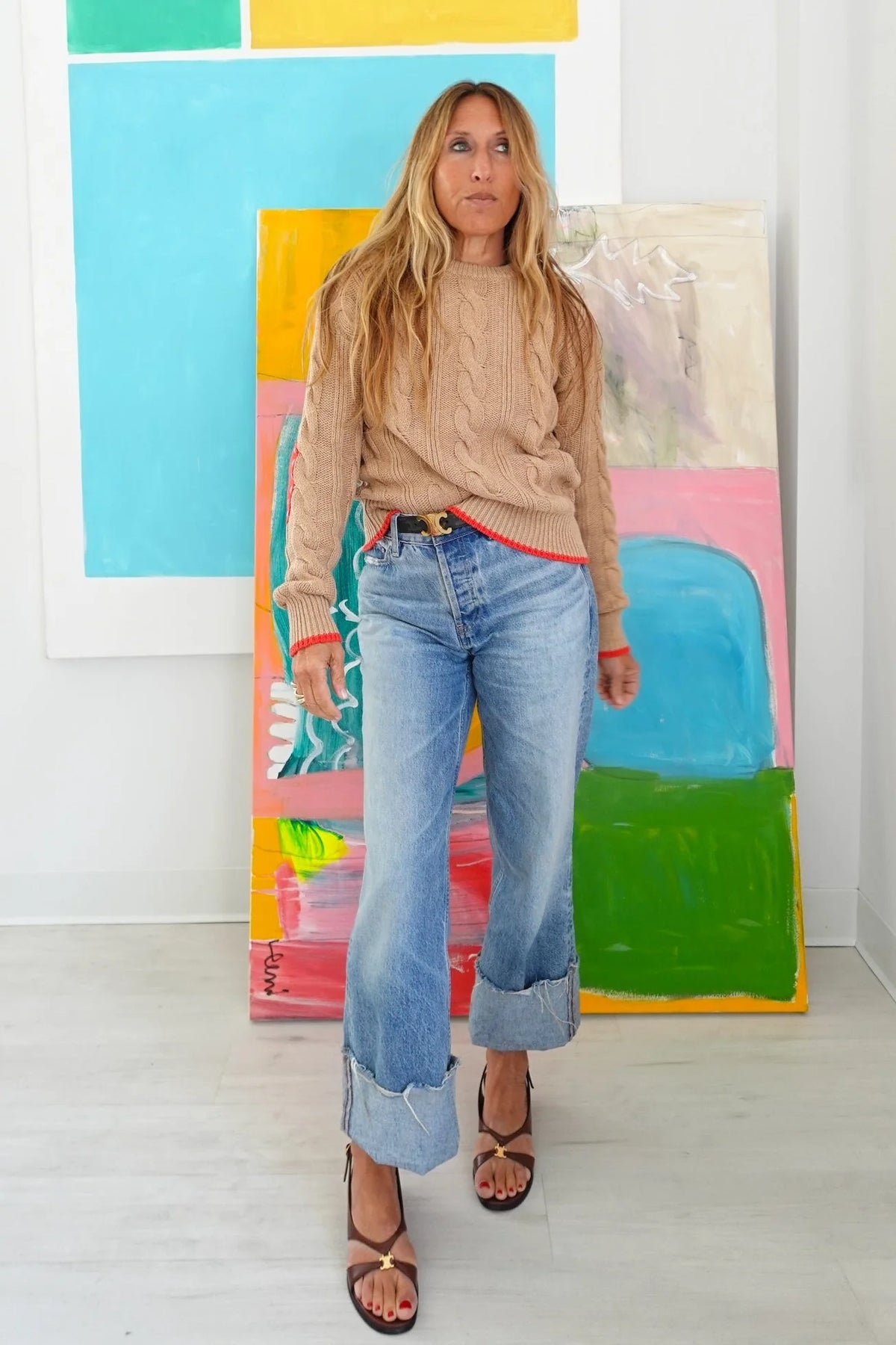 Maxwork Cable Sweater by Kerri Rosenthal in a vibrant, art-filled room for a modern, colorful lifestyle look.