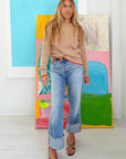Maxwork Cable Sweater by Kerri Rosenthal in a vibrant, art-filled room for a modern, colorful lifestyle look.
