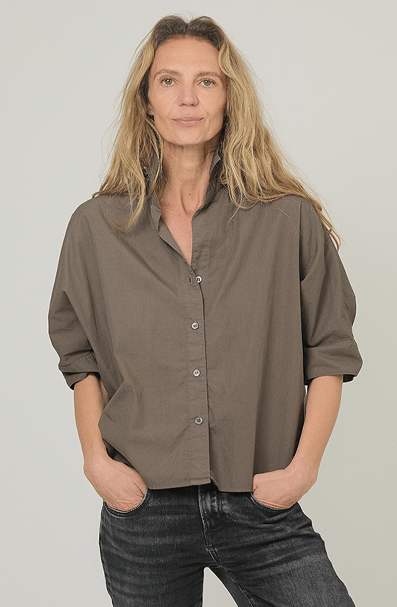 Dark olive Monday12 Daria Shirt in relaxed fit, styled with black jeans; casual, modern look.