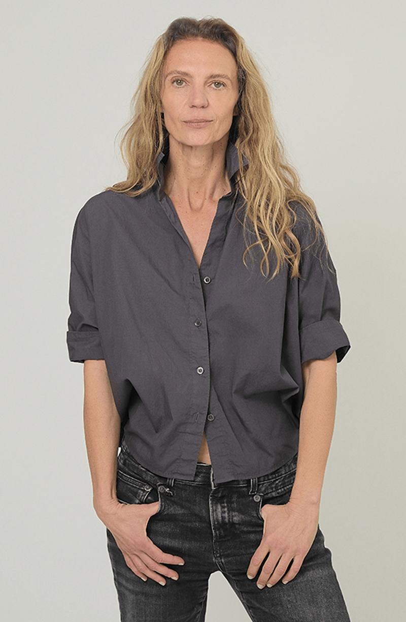 Monday12 Daria Shirt styled with jeans; casual look on model with wavy blonde hair, light background.
