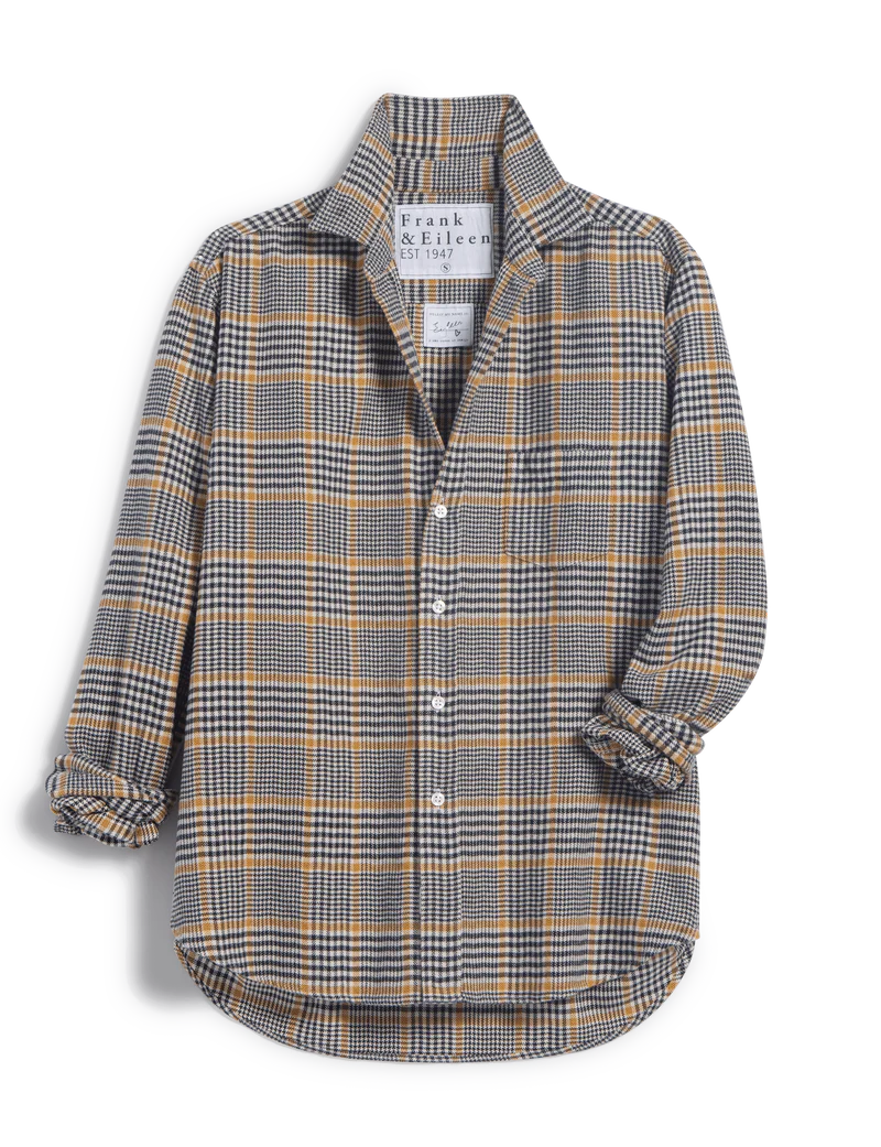 The Eileen Button Up Shirt F25 by Frank & Eileen features a relaxed fit, long sleeves, and a plaid pattern in grey, white, black, and mustard yellow for a casual California-inspired look. Rolled-up sleeves and bust-flattering buttons complete the style.