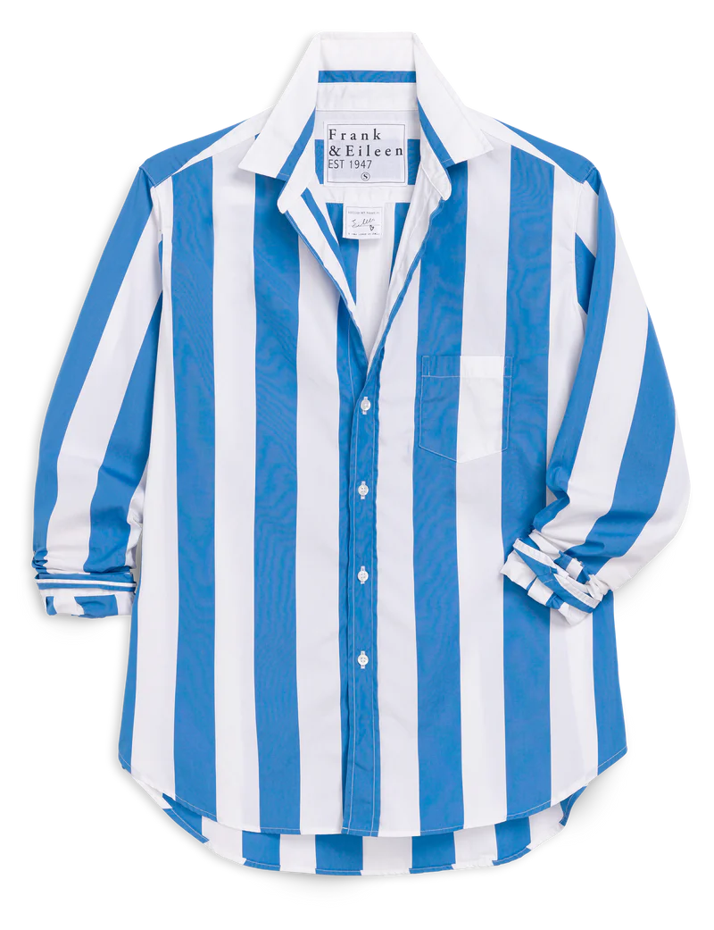 The Eileen 26 by Frank &amp; Eileen is a blue and white vertically striped button-up shirt with a collar, chest pocket, long rolled-up sleeves, relaxed fit, and bust-flattering button placement. The label inside the collar reads "Frank &amp; Eileen.