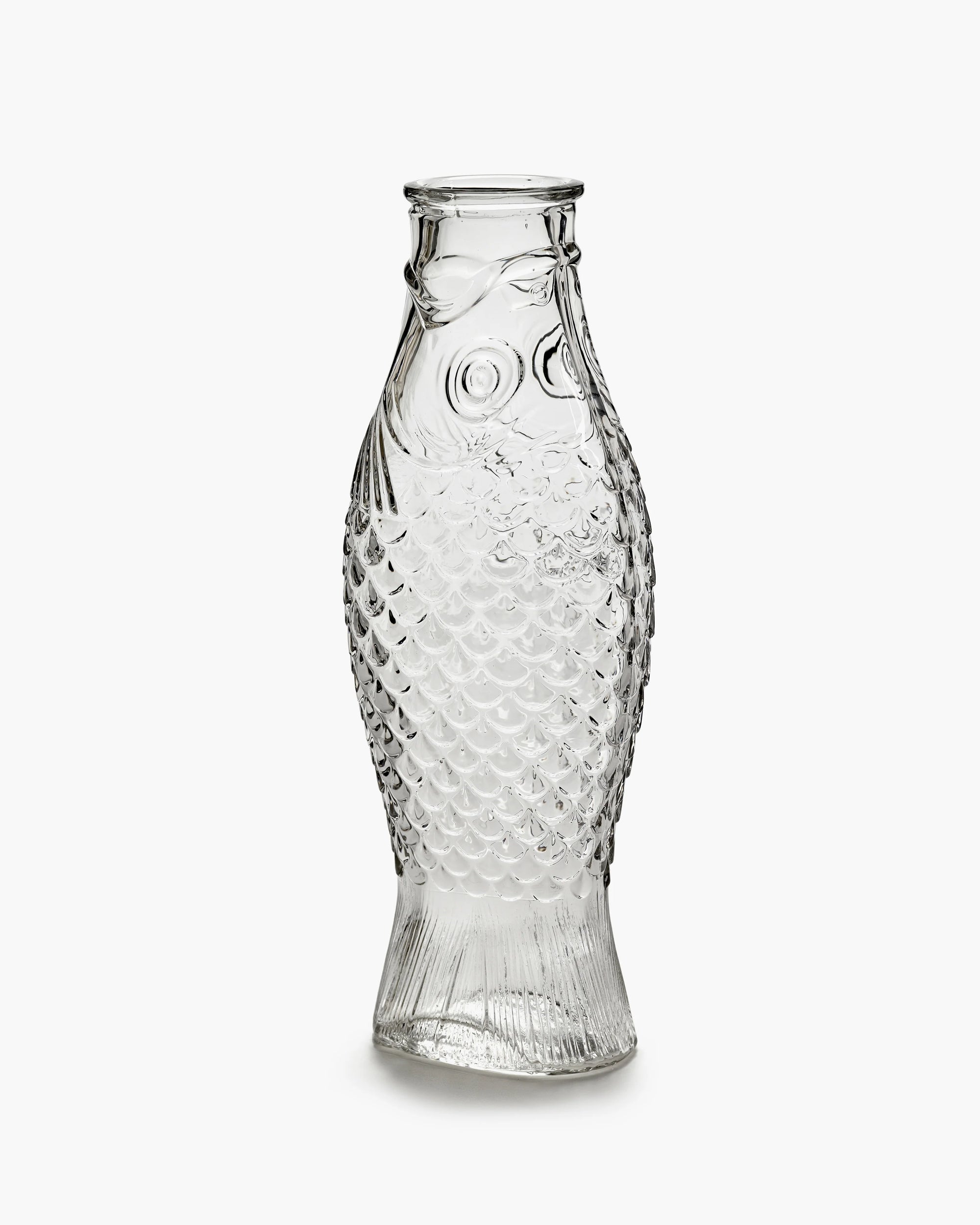 Clear glass carafe with scaled fish design and fins, by Serax, perfect for unique kitchen or dining decor.