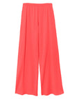 The Emmette Sweatpant by Xirena is a bright coral pink, wide-leg fleece pant with an elastic waistband and relaxed, loose fit. Made in Los Angeles, these sweatpants have no visible pockets or embellishments.