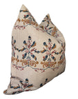 The Rennah Collective Birdie Pillow 22x22 features a beige background with an intricate floral design in blue, gold, and red on a soft woven cover, displayed against a white backdrop.