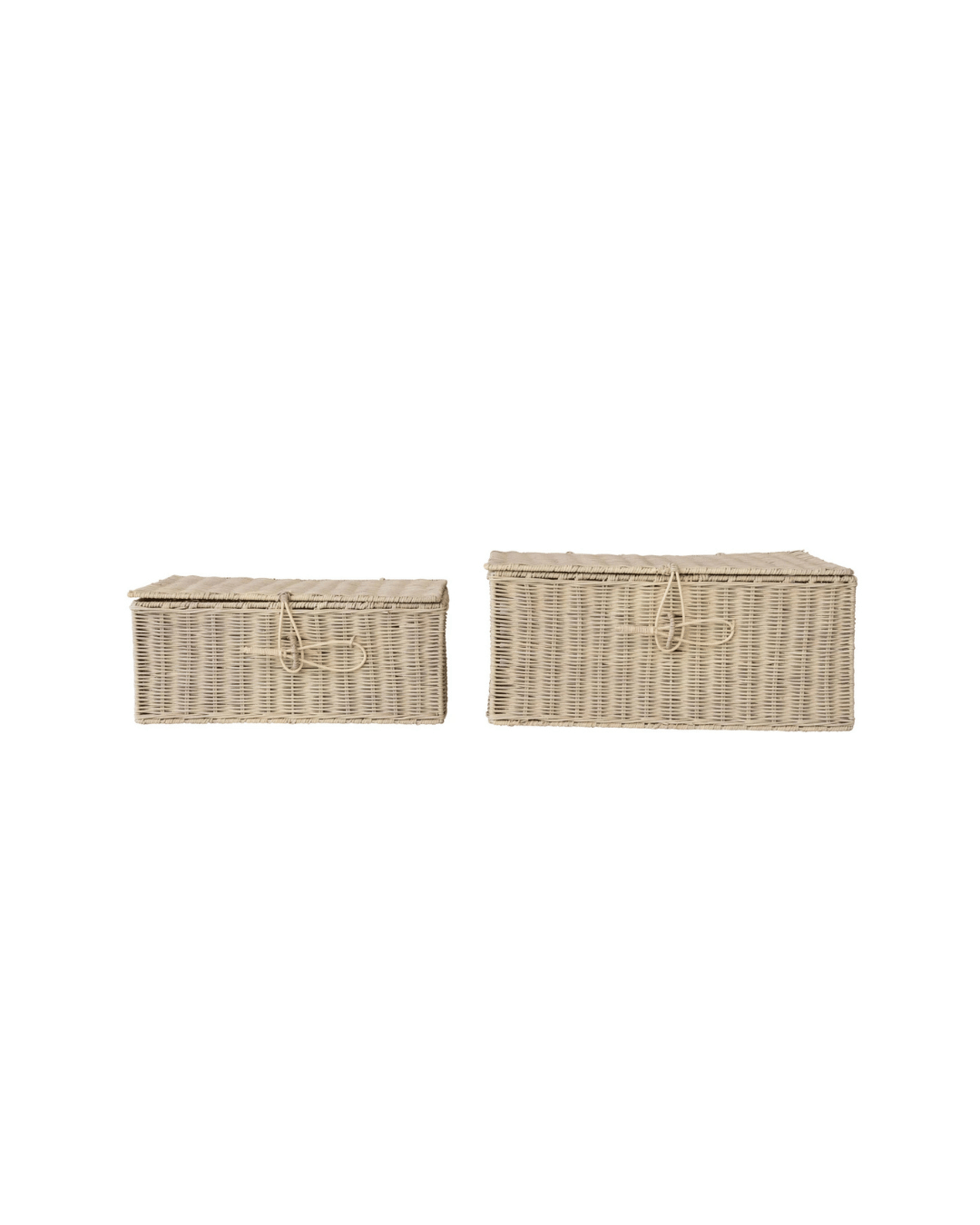 Two Creative Co-op hand-woven rectangular rattan boxes with loop closures, the left smaller than the right, are set against a white background. Their bleached finish adds elegance to any space.