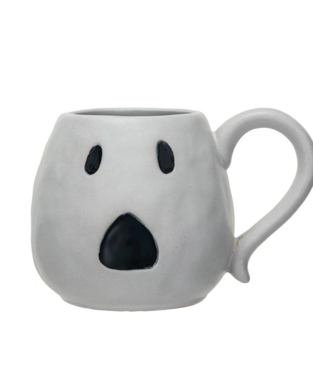 The Creative Co-op Ghost Mug is a stoneware piece designed in a ghost shape, featuring a handle on the right side. Its matte white and black finish highlights two black oval eyes and a small black oval mouth, creating a surprised expression. The surface of this distinctive mug has a slightly uneven texture for added charm.