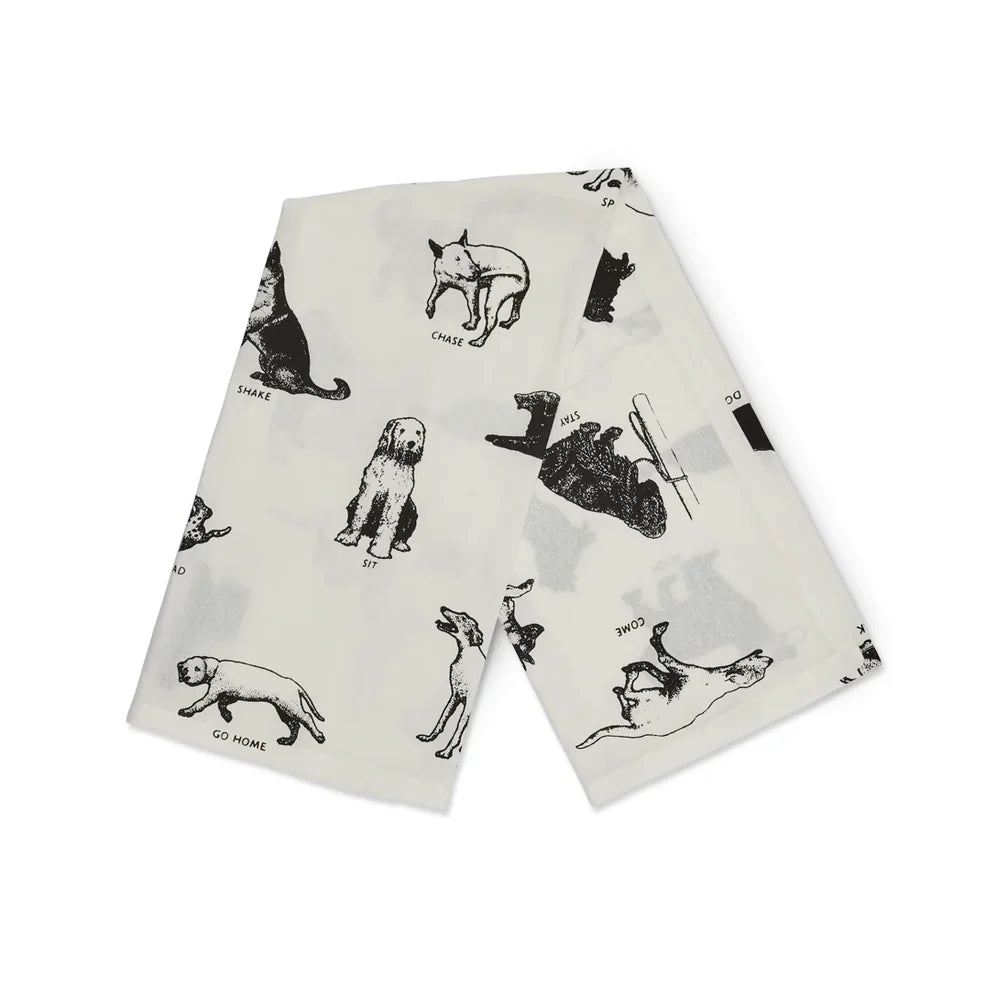White cotton tea towel with playful illustrated dog tricks, Fishes Eddy, kitchen accessory, 20x28 inches, machine washable.