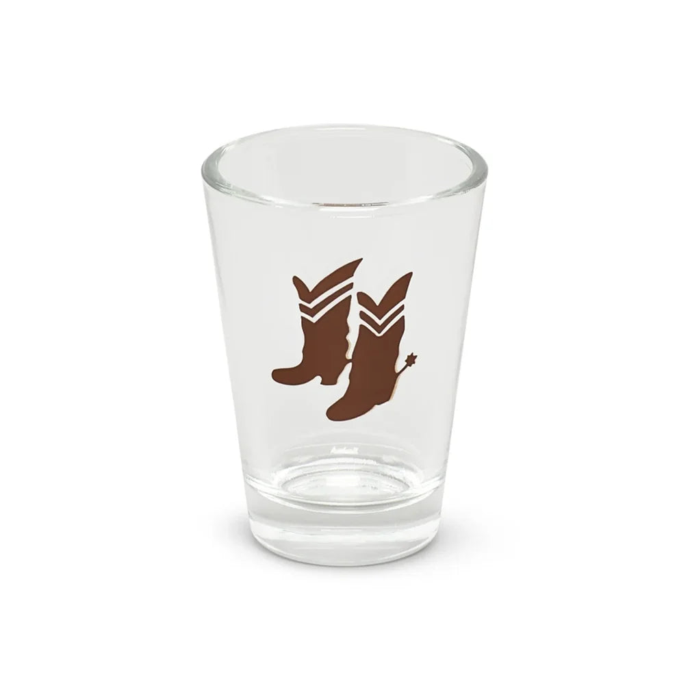 Clear shot glass with two brown cowboy boots design, by Fishes Eddy, made from recycled glass.