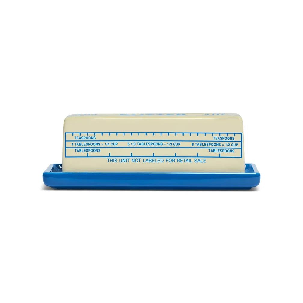 Blue Fishes Eddy Butter Stick Dish, dishwasher safe, holds a stick of butter with measurement markings visible.