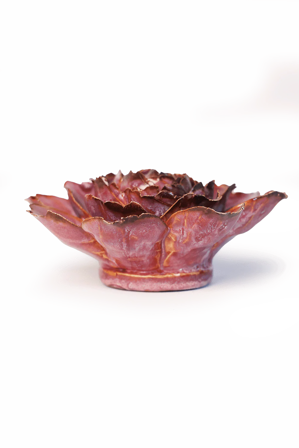 The Dewberry Camellia by Chive Ceramics (thru Faire) is a ceramic flower wall art bowl with layered petals, glazed in deep pink and red hues with brownish edges—a striking statement piece for any room.