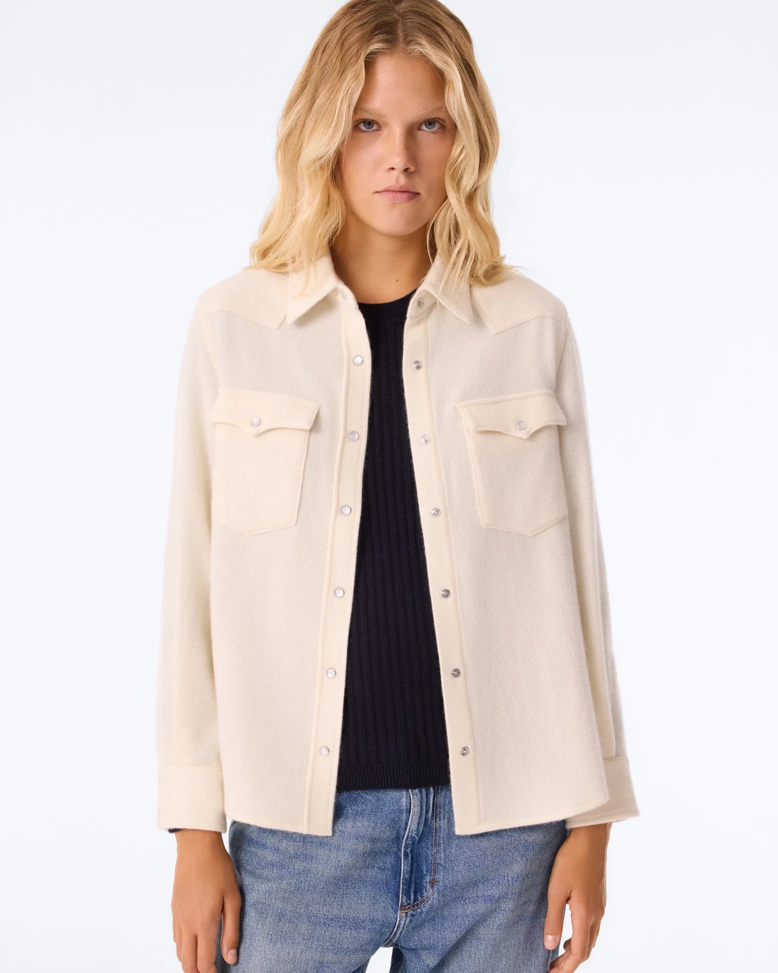 KUJTEN Lumber L/S Shirt layered over a black top and blue jeans, styled simply against a neutral background.
