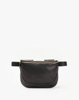 The Clare Vivier Fanny Pack Fall 25 is a black belt bag in natural grain leather, featuring a gold zipper and adjustable strap for hands-free convenience, shown against a white background.