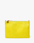 The Clare Vivier Flat Clutch W/ Tabs S25 is a rectangular yellow bag with a crocheted cotton surface, silver zipper, tan leather pull, and a round gold charm, shown against a plain white background.