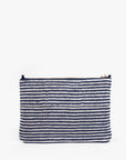 The Clare Vivier La Plage Flat Clutch w/tabs features a rectangular shape, horizontal navy and white stripes, top zipper closure, and a simple textured terry cloth design. Photographed on a plain white background.