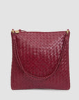 Maroon handwoven leather foldover clutch with braided handle and gold zipper by Clare Vivier.