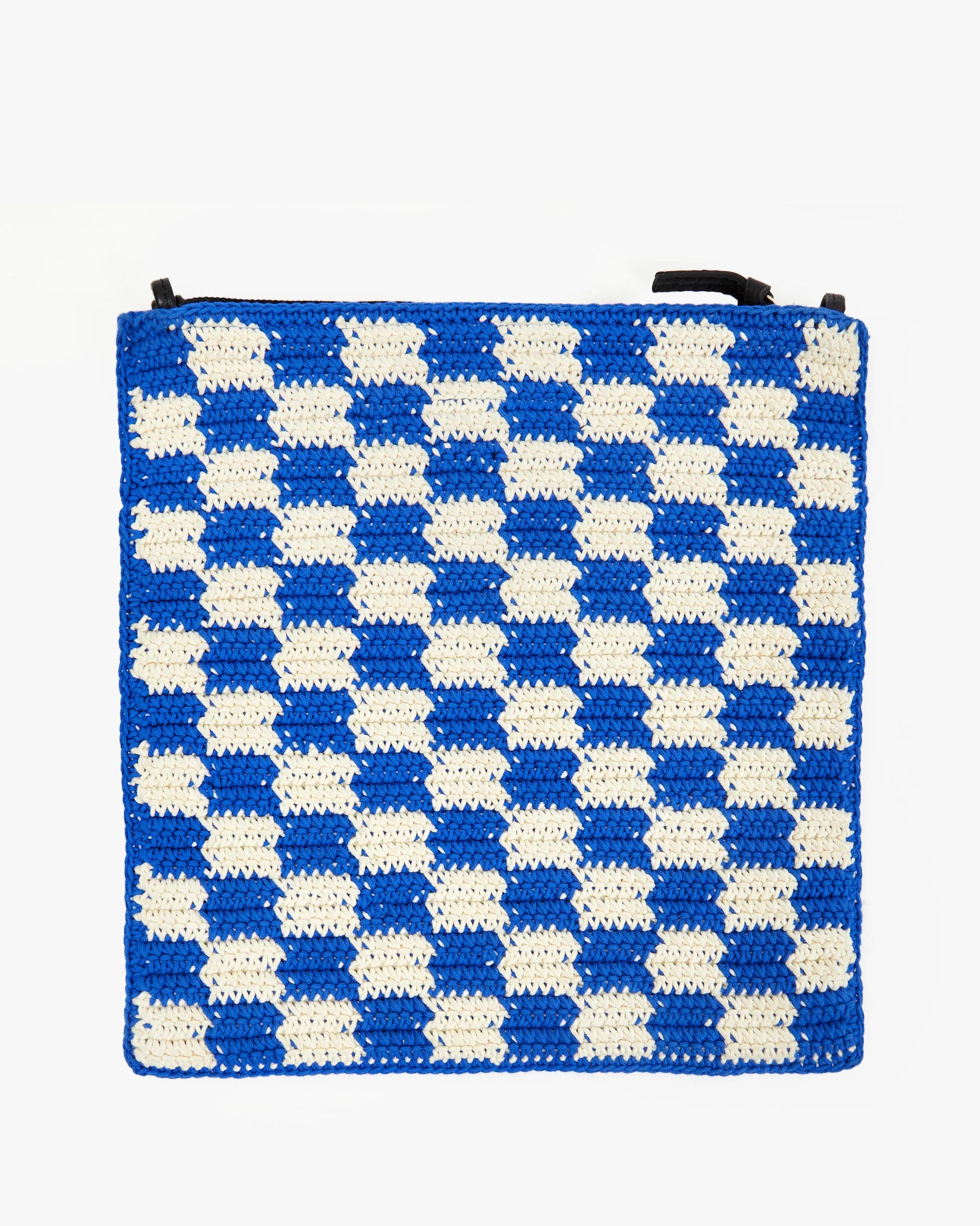 A crocheted cotton bag featuring a checkered pattern with alternating blue and white squares. The Foldover Clutch w/Tabs by Clare Vivier has dark handles at the top.