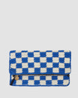 A Clare Vivier Foldover Clutch w/Tabs featuring a blue and white checkered pattern. The bag has a flap closure and a visible zipper pocket on the front adorned with a small gold-colored charm. The background is plain white.