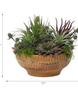 The Succulent Wood Bowl by Natural Decorations Inc. features an 11" wide, 9" tall round ribbed wood bowl filled with maintenance-free green and purple artificial succulents and moss, with simple arrows showing its height and width.