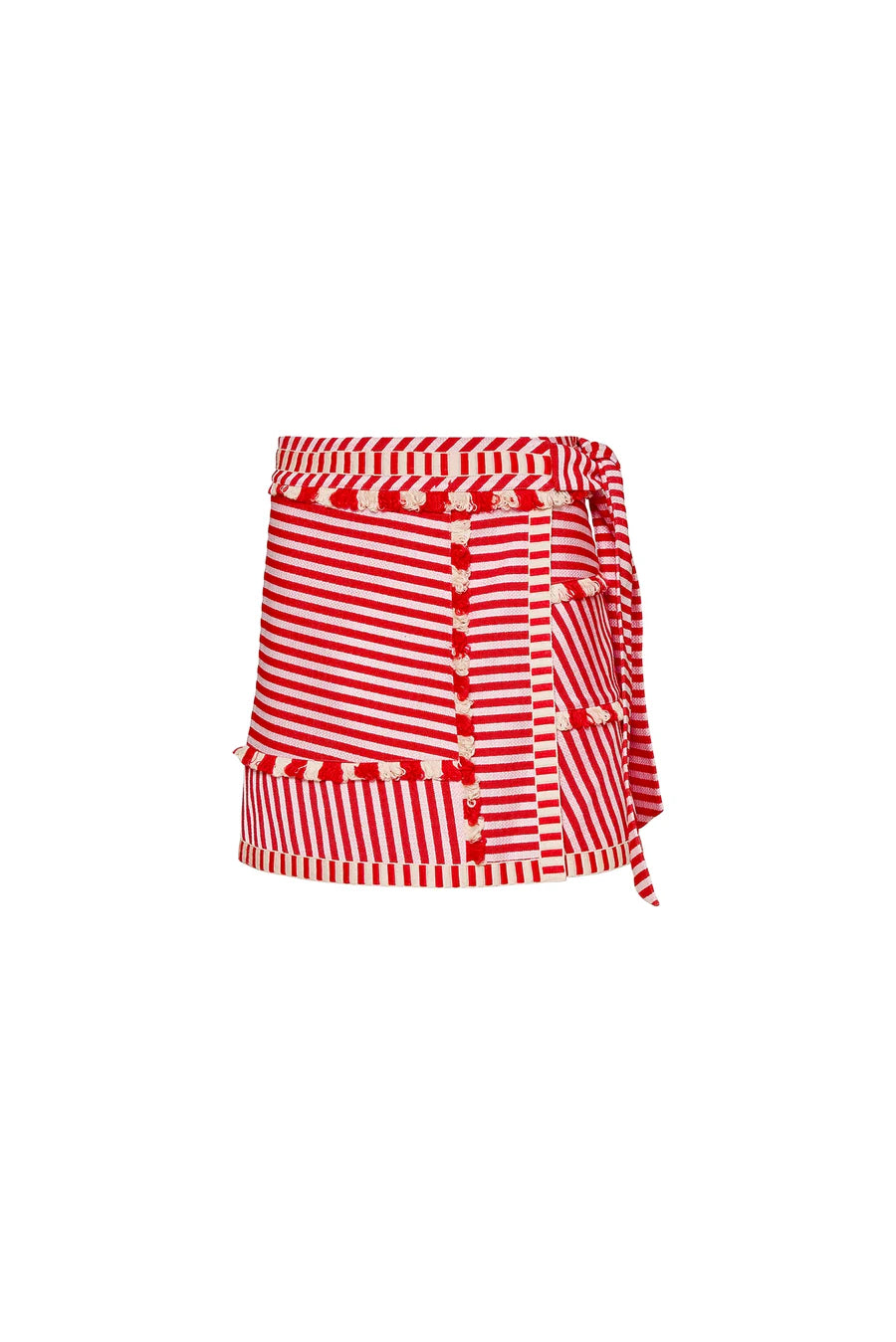 The Bay Skirt by Hunter Bell NYC is a fitted mini skirt with red and white yarn-dyed stripes in vertical and horizontal patterns. It features decorative trim with semi-circular designs and a tied ribbon on the side for an elegant wrap-around look.