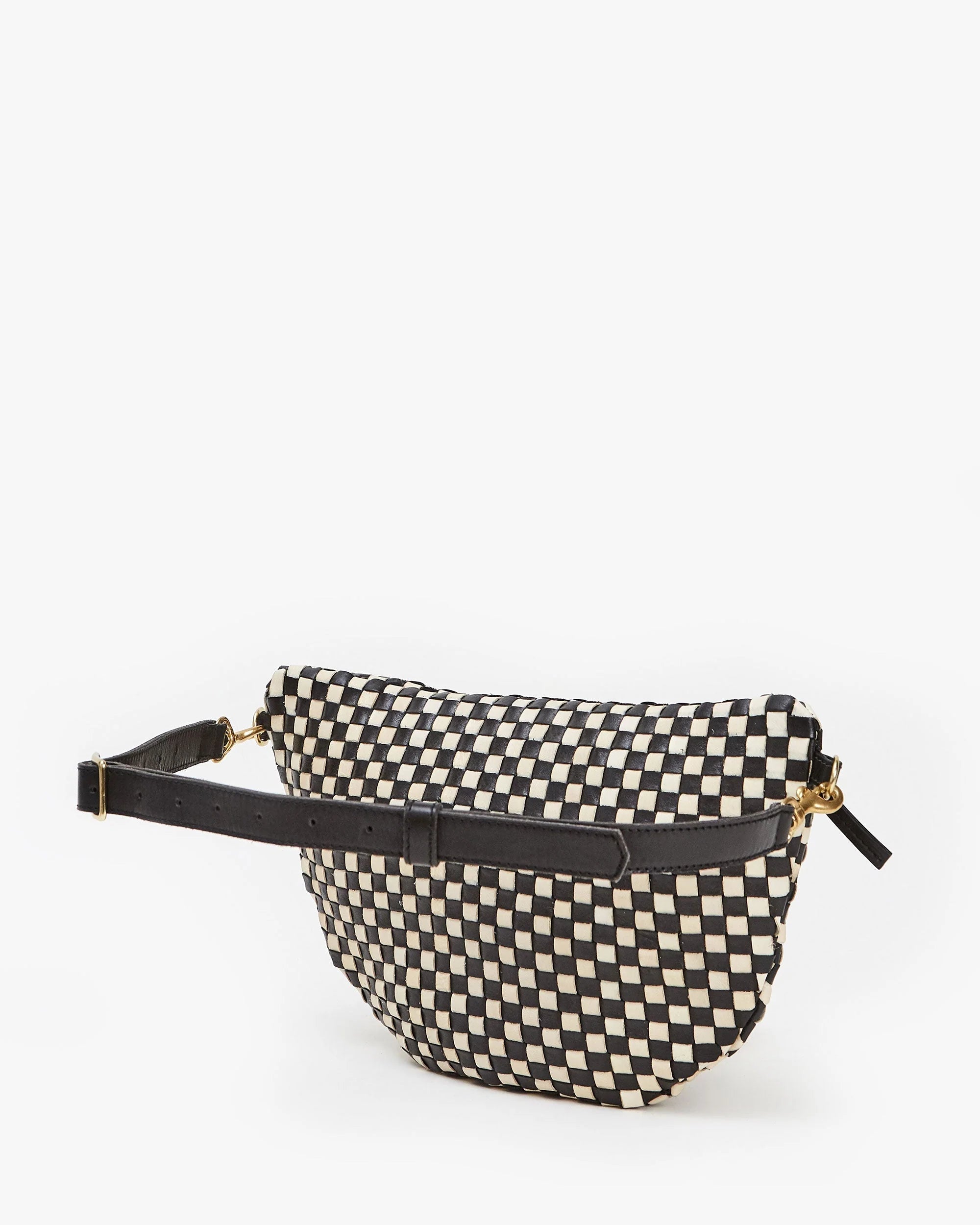 The Grande Fanny S25 by Clare Vivier is a black and white checkered crossbody bag with a black adjustable strap and gold hardware, shown on a plain white background.