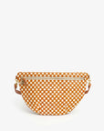 The Clare Vivier Grande Fanny Woven Checker, a checkered orange and white handbag with a zipper, is displayed on a plain white background. It comes with an adjustable strap for hands-free use, dual side handles, and elegant gold hardware.