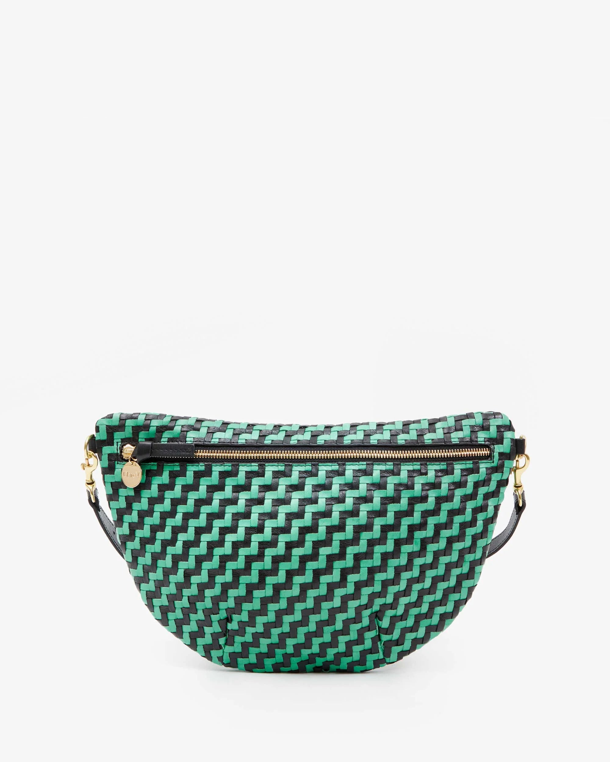 The Grande Fanny Zig-Zag by Clare Vivier is displayed against a plain white background. This green and black woven-patterned crossbody bag features a front zipper with a gold pull and an adjustable strap, effortlessly combining style and functionality.