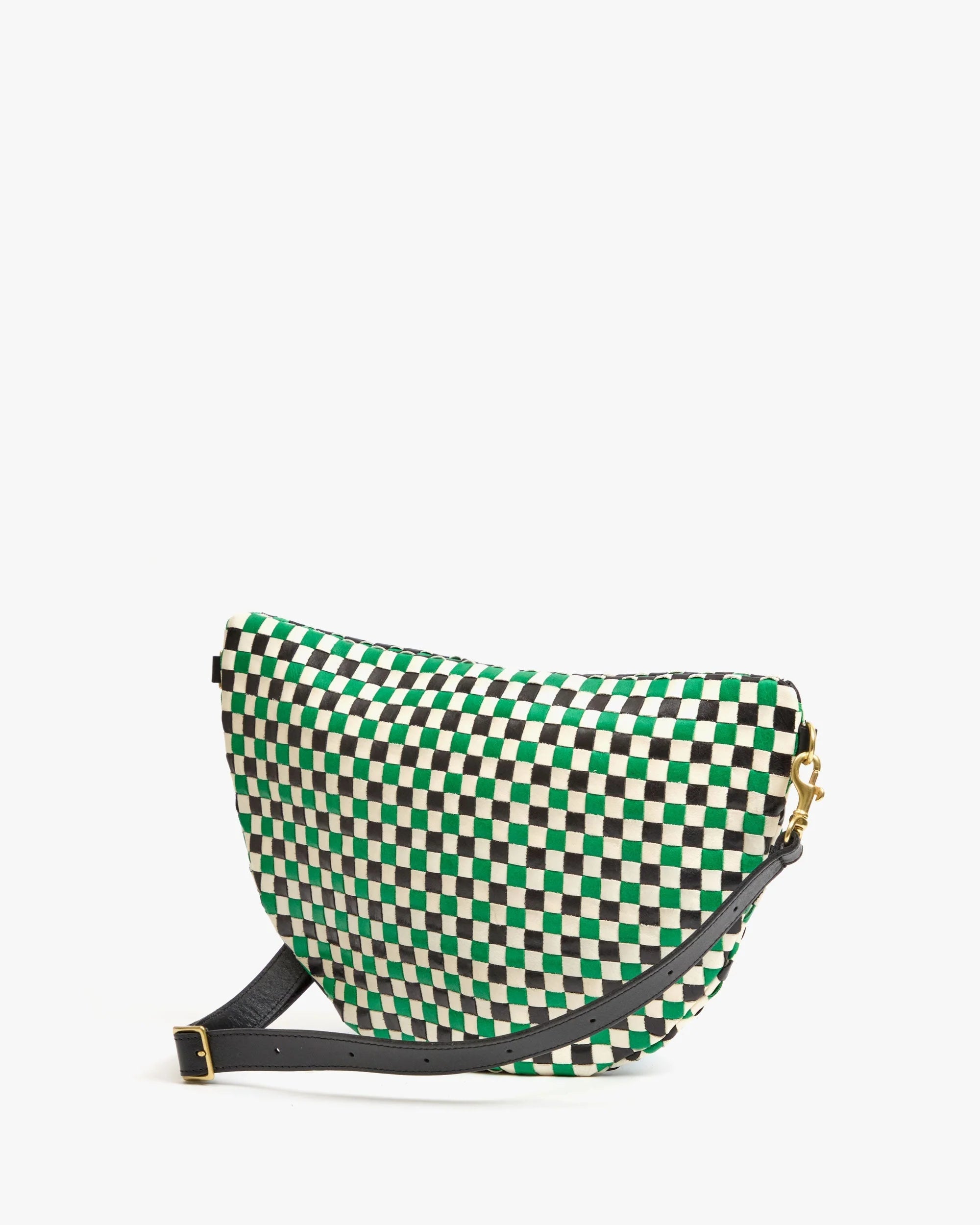 The Clare Vivier Grande Fanny S25 is a stylish crossbody bag with a green, black, and white checkerboard pattern, gold hardware, and a black adjustable strap, shown against a plain white background.