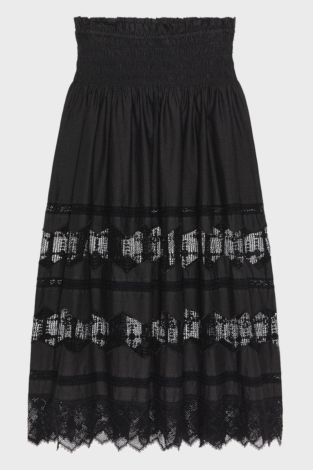 The Rosette Crochet Canary Skirt by The Great Inc. is a black cotton midi skirt with a smocked waistband, sheer lace panels, crochet accents, and a lace-trimmed hem, shown against a white background.