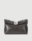 Dark brown leather Staud Cuff Clutch with silver clasp on white background, Bungalow Furniture & Accessories.