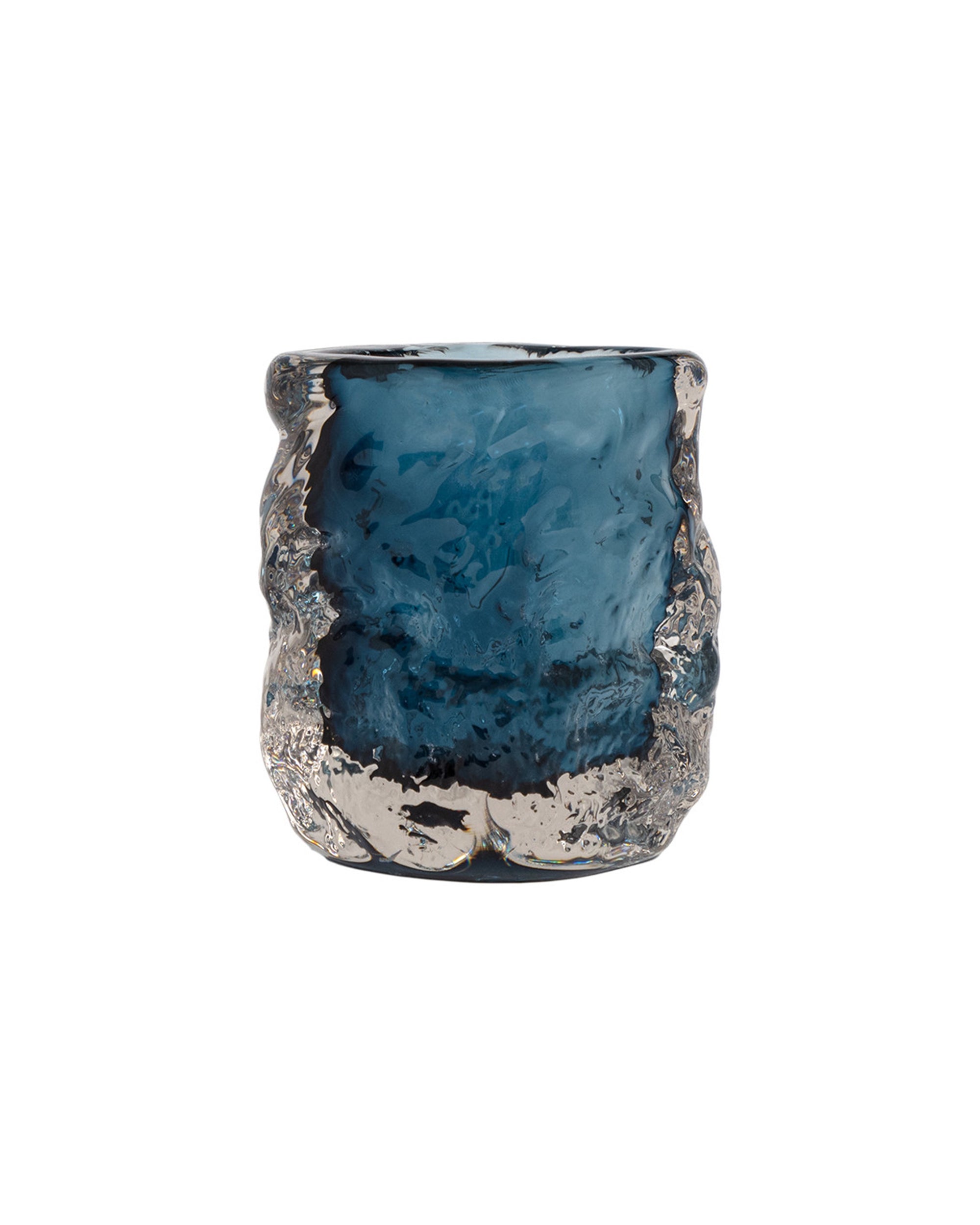 The Import Collection 49-706 Hendrick vase features blue glass with an uneven, textured surface and a wavy, organic shape, reminiscent of a decorative tumbler, set against a white background.