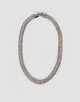The Clare Vivier Herringbone Collar is a silver, textured rhodium-plated necklace with a sleek, rounded design and foldover clasp, shown on a plain white background.