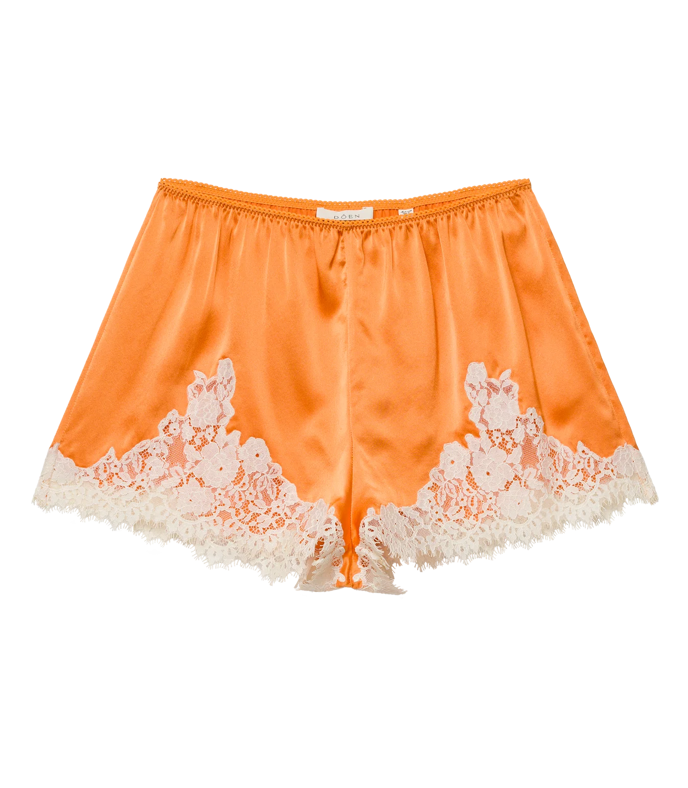The DOEN Iona Short is a high-waist orange satin pair, featuring white floral lace trim along the hem and sides, shown on a white background.