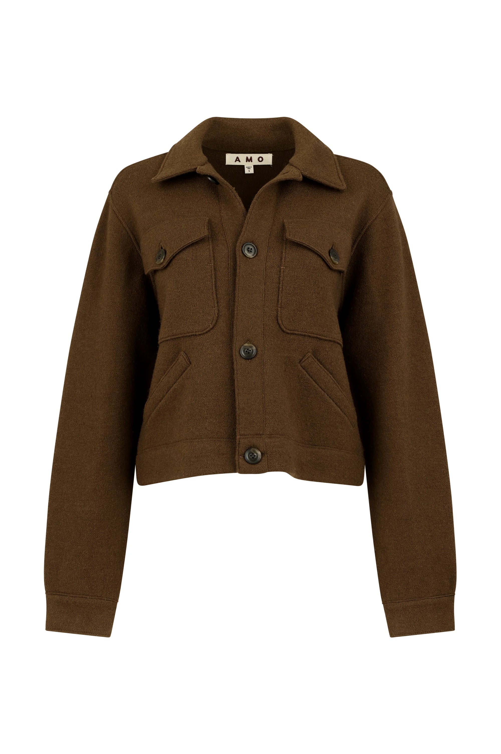 The Isabelle Jacket by AMO Denim is a brown, long-sleeve cropped trucker style with large front buttons, two flap chest pockets, denim seams, and a collar, shown against a white background for a flattering silhouette.