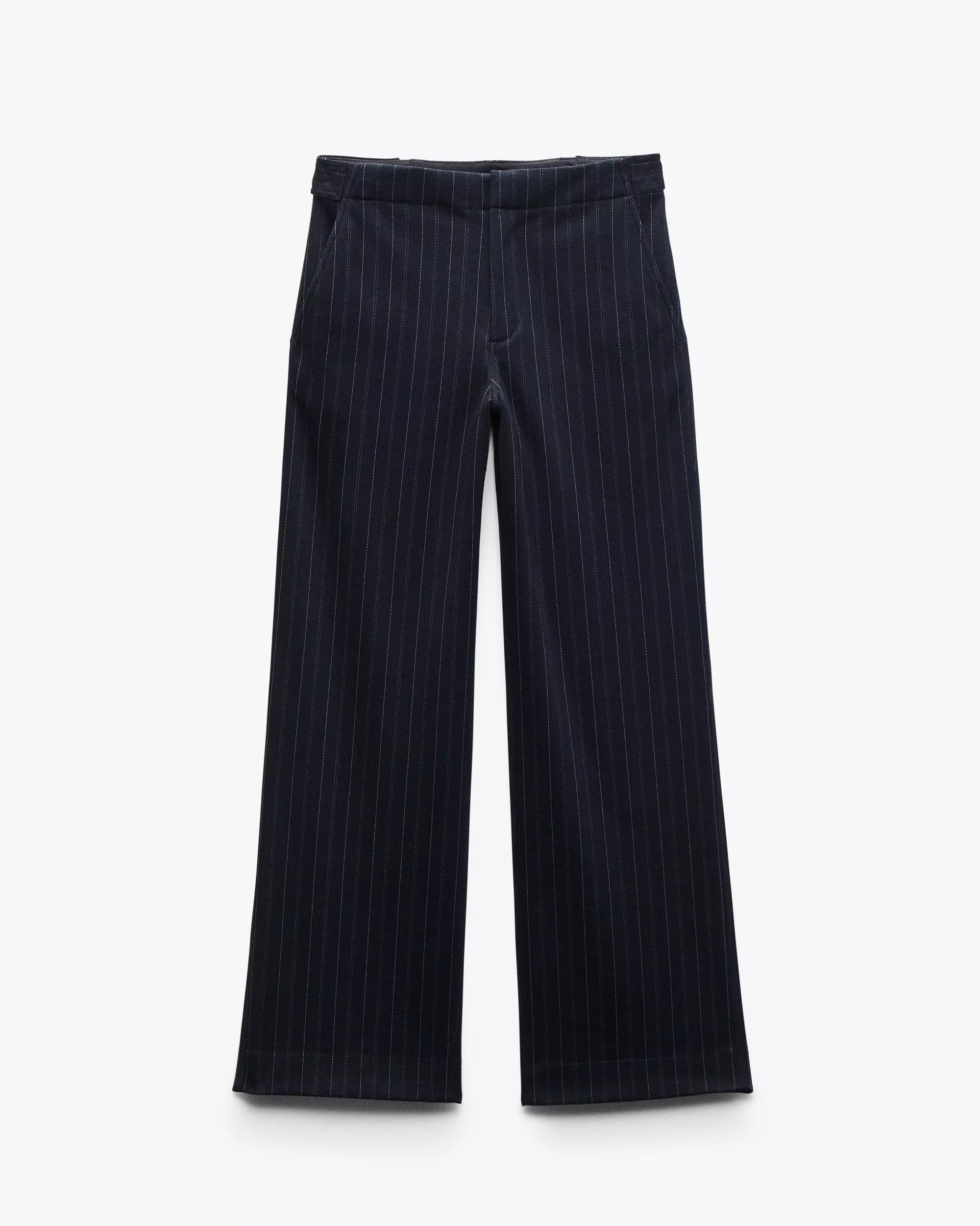The Rag & Bone irina ponte tailored pant in navy features wide legs, subtle white pinstripes, two front pockets, and a tailored waistband, shown laid flat on a white background.