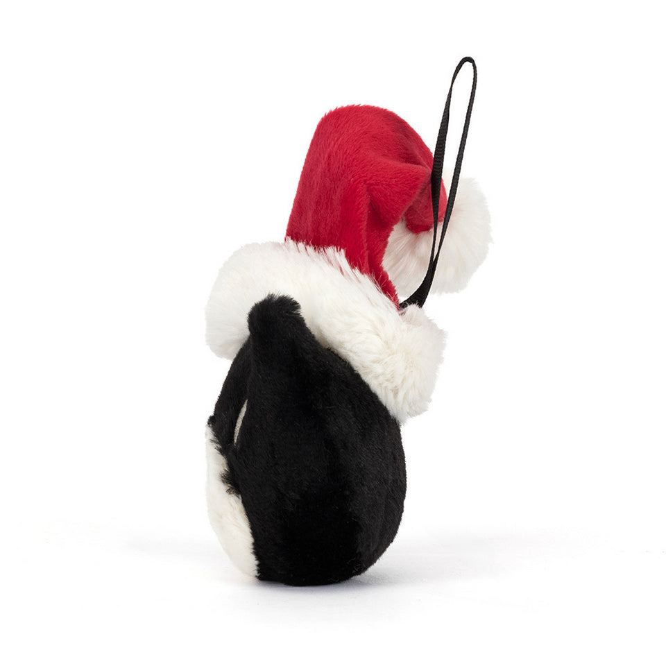 The Jellycat Jack Decoration by Jelly Cat Inc. is a black and white plush ornament wearing a red and white Santa hat with a black hanging loop—perfect as a festive cat Christmas decoration against a white background.