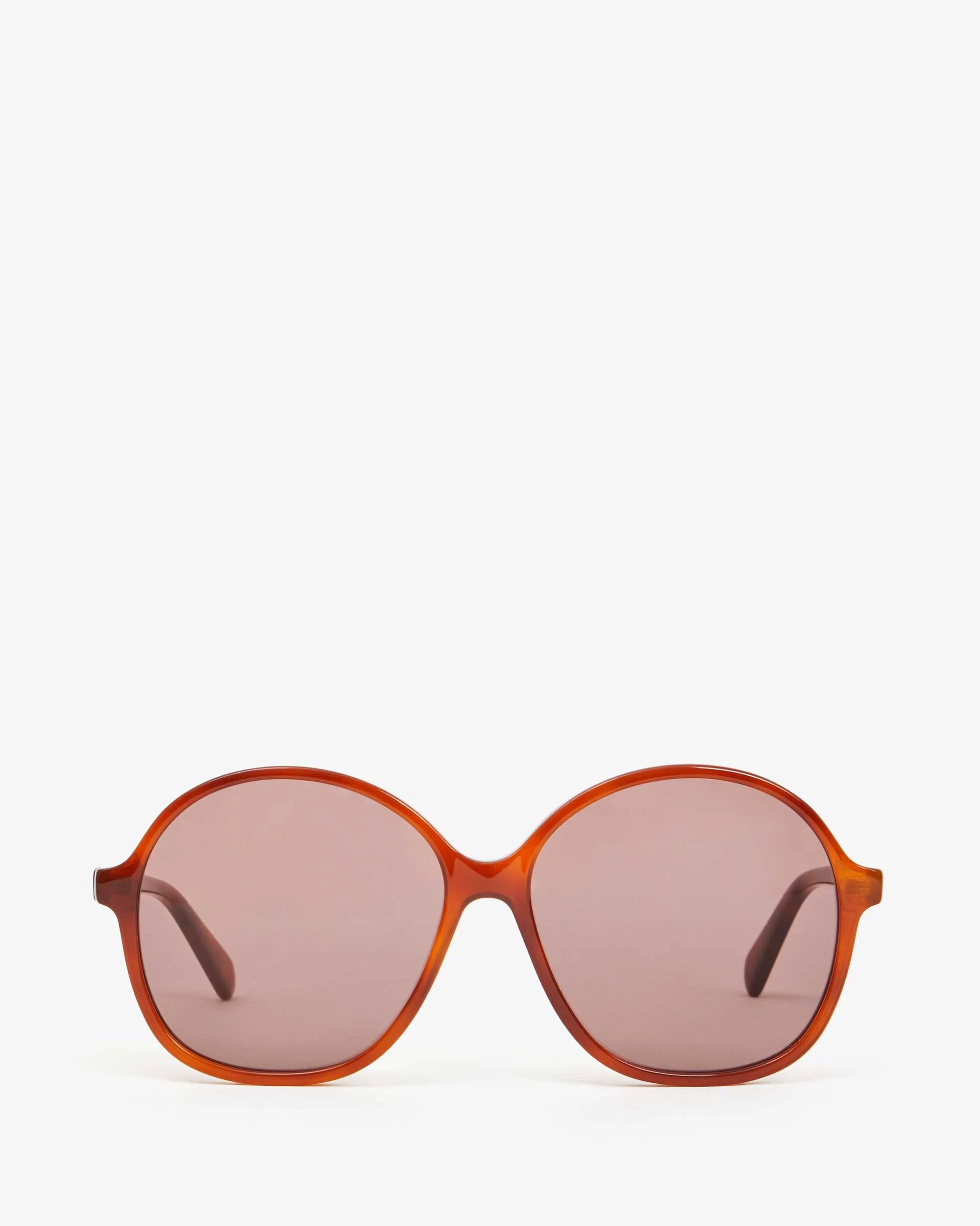 Front view of stylish Jane Sunglasses by Clare Vivier, featuring oversized oval lenses with a brown tint and a slim, glossy orange frame. Crafted with recycled materials, these sunglasses offer UVA/UVB protection. The plain white background emphasizes the sleek design and modern look.