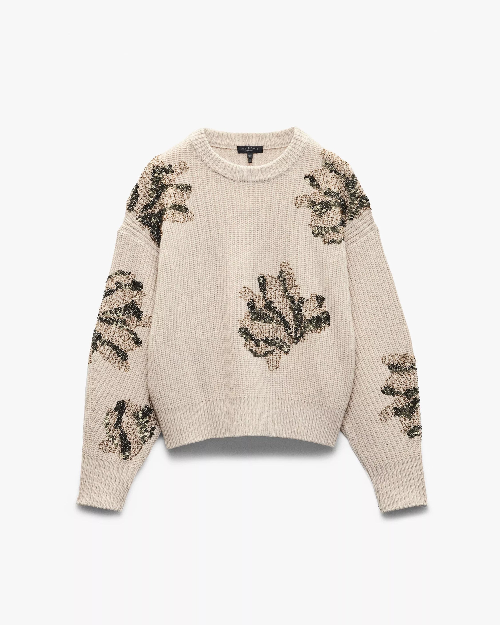 The julie sequin wool sweater by Rag & Bone is a cream relaxed fit, featuring abstract floral embroidery with green sequins and gold-toned embellishments on the front, sleeves, and shoulders.