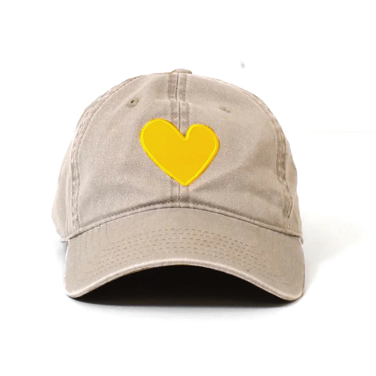 The Kerri Rosenthal Embroidered Heart Hat features a beige design with a yellow heart stitched on the front, offering a fresh take on classic collegiate style. Shown against a plain white background.