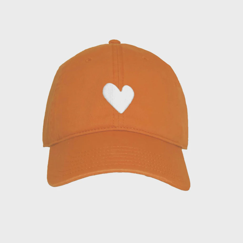 The Kerri Rosenthal Texas Baseball Hat Heart Patch is an orange 100% cotton cap with a white heart design on the front center, ideal for those who appreciate simplicity and style.