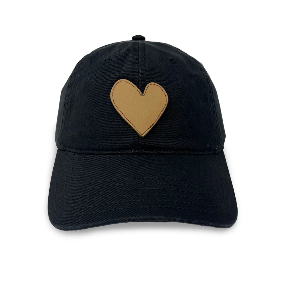 The Kerri Rosenthal Embroidered Heart Hat is a black collegiate cap with a tan heart-shaped embroidered patch on the front, shown against a white background.