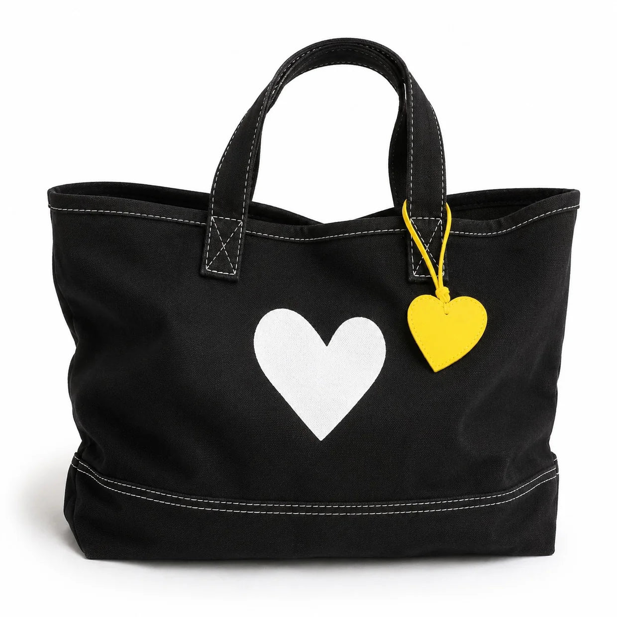 Black cotton tote with white heart detail and yellow leather charm by Kerri Rosenthal, Imperfect Heart Tote.