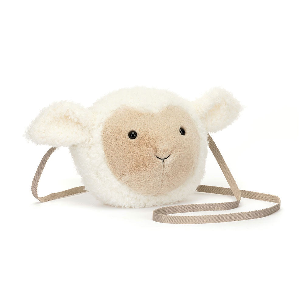 Introducing Jelly Cat Inc.'s Little Lamb Bag, a quirky country chic accessory designed like a sheep's head. It features a white fluffy exterior, beige face, small black eyes, and a light brown strap for easy carrying.